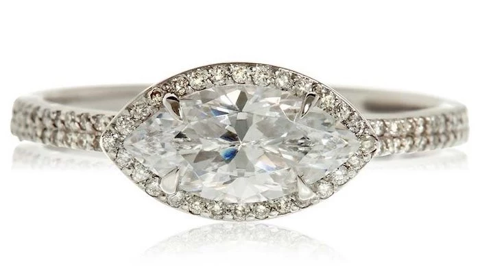eye shaped diamond surrounded by smaller diamonds, engagement ring styles, white background
