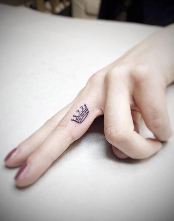 49 Elegant Cross Tattoos On Finger