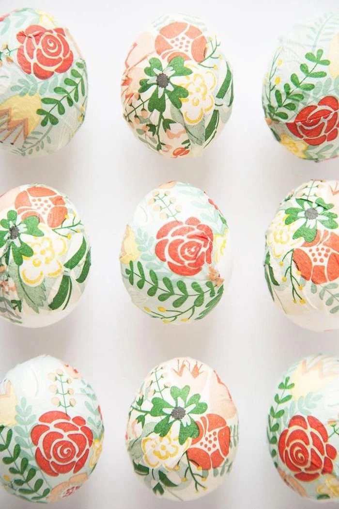 floral decoupage eggs, colourful eggs, on a white background, natural egg dye
