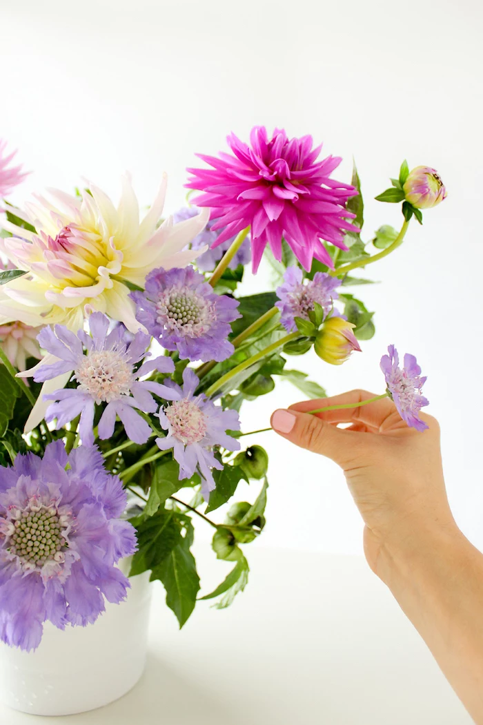 diy tutorial, flower centerpieces, colourful flower bouquet, in a white vase, in front of a white background