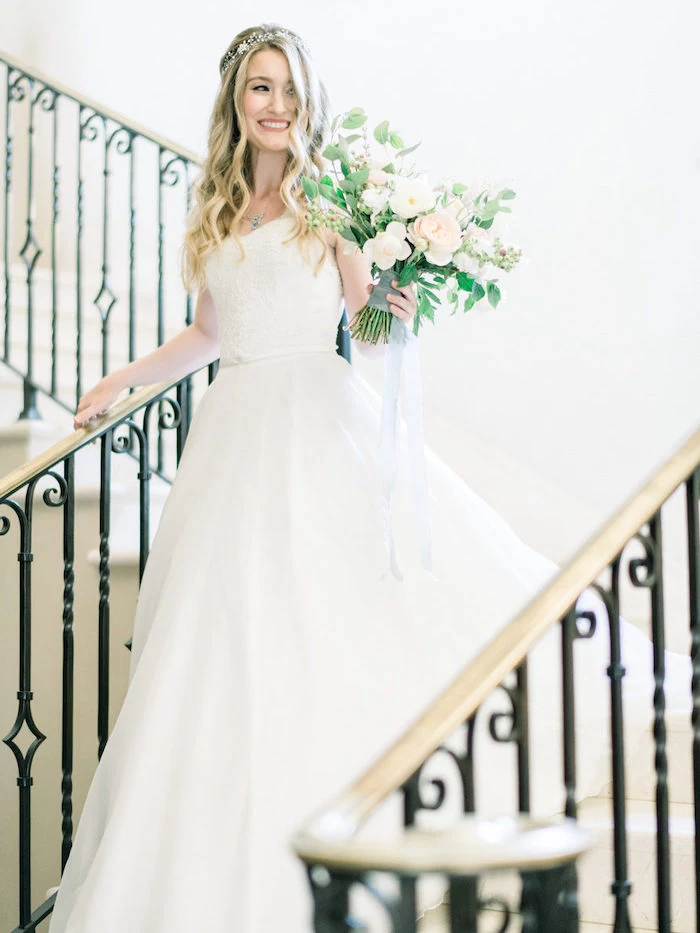 long white dress, easy hairstyles to do yourself, large flower bouquet, long wavy blonde hair, large staircase