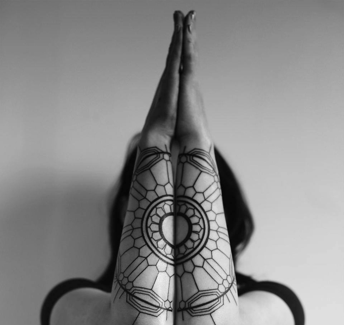 back forearm tattoos, set of hands, geometrical tattoo on both hands, girl standing in front of a white wall