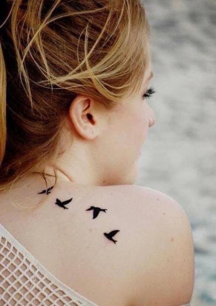 four birds flying away shoulder tattoo, small tattoos with meaning, woman with blonde hair