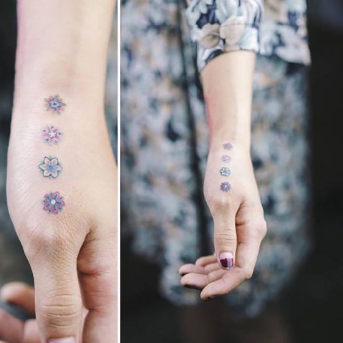 four colourful flowers hand tattoo, small tattoos with meaning, woman wearing a floral dress