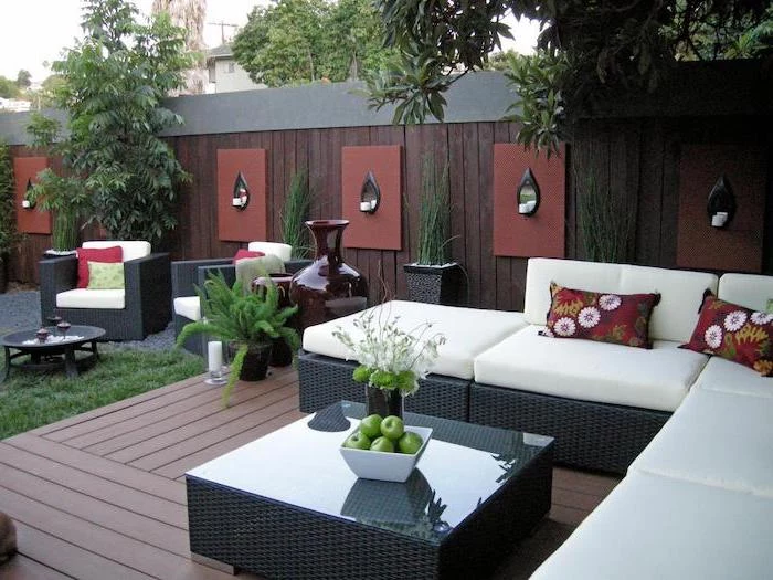 garden furniture, with colourful throw pillows, small backyard landscaping ideas, on a wooden floor