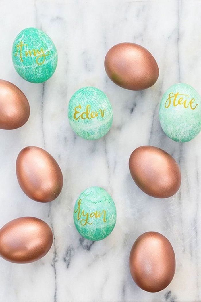 rose gold eggs, how to make easter eggs, turquoise eggs, with gold names, on a marble countertop