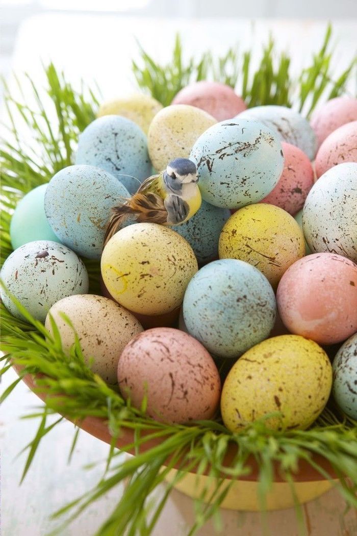 colourful eggs, in a wooden basket, with grass inside, plastic bird on top, how to make easter eggs