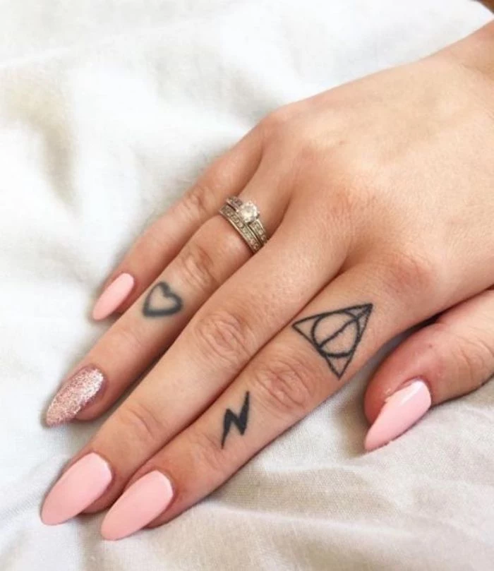 harry potter and the deathly hallows inspired, heart and lightning bolt, finger tattoos, small finger tattoos