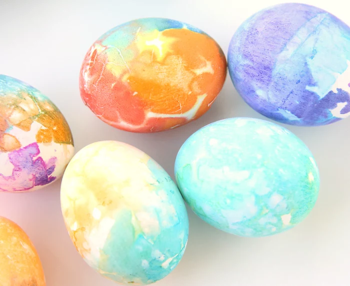 colourful dyed eggs, blue and red, purple and orange colours, dying easter eggs with food coloring