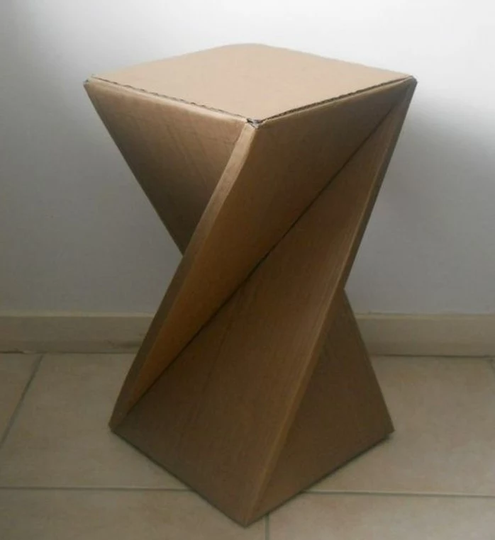 tiled floor, abstract design, cardboard stool, cardboard table, in front of a white wall, cardboard ideas