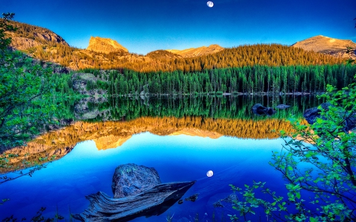 mountain landscape, lots of trees, surrounding a large lake, spring wallpaper for desktop, moon in the sky