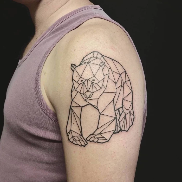 bear drawn with geometrical shapes, shoulder tattoo, pink tank top, geometric tattoo