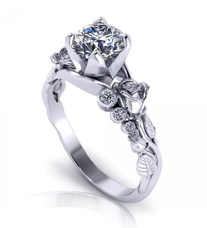 round diamond in the middle, white gold roses on the band, non traditional engagement rings