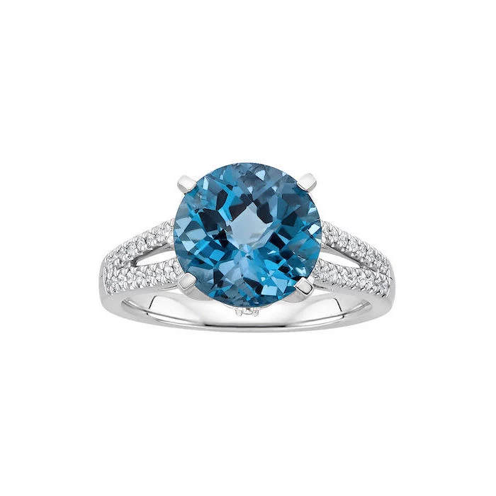round blue sapphire, diamond studded band, non traditional engagement rings, white background