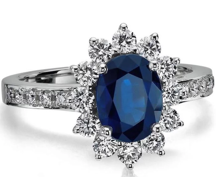 large sapphire, surrounded by diamonds in a flower shape, beautiful engagement rings