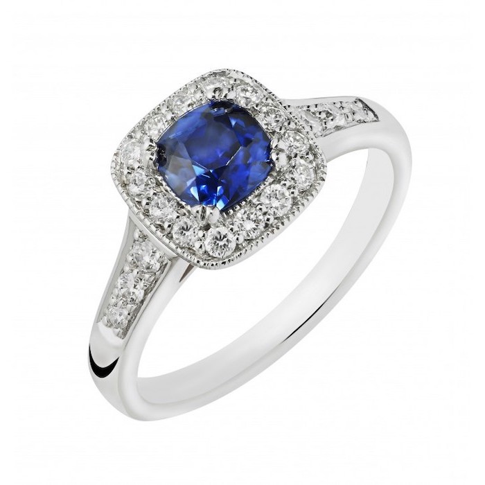 square cut sapphire surrounded by diamonds, white gold band, beautiful engagement rings
