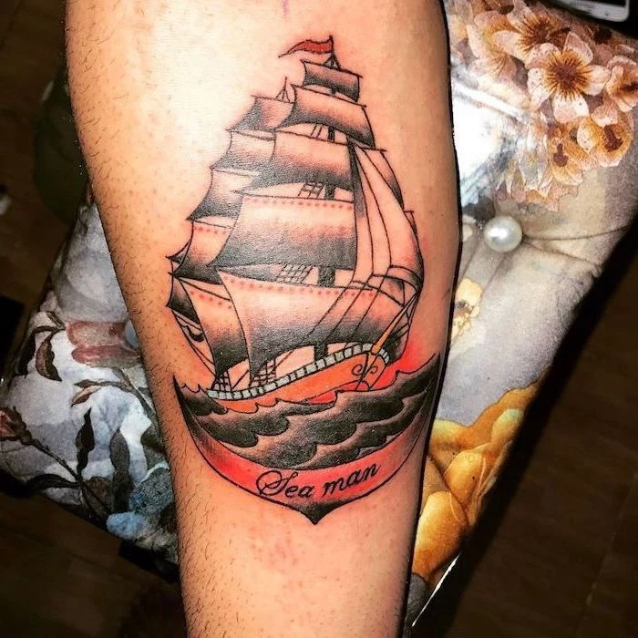 ship sailing, sea man inscription, coloured leg tattoo, wrist tattoos for men