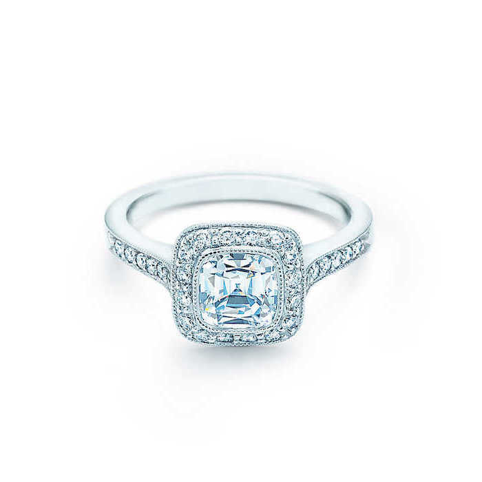 diamond studded band, white background, engagement and wedding rings, large square cut diamond