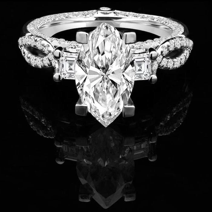 large diamond, black background, round halo engagement rings, diamond studded band