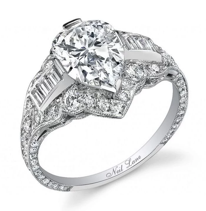 round halo engagement rings, teardrop diamond, diamond studded white gold band