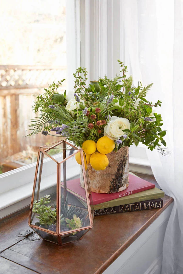succulents in a hexagonal closed vase, flower arrangements, wooden vase, with lemons and greenery