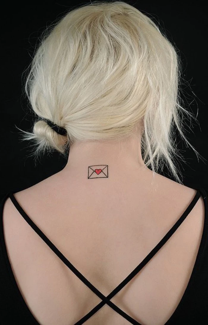 letter envelope with a heart back tattoo, woman with blonde hair, small bestfriend tattoos