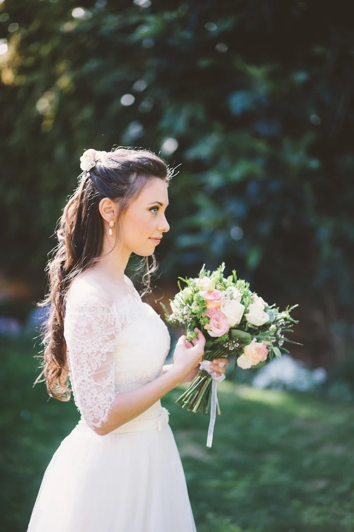 long wavy brown hair, long hair wedding styles, large flower bouquet, flower hair accessory