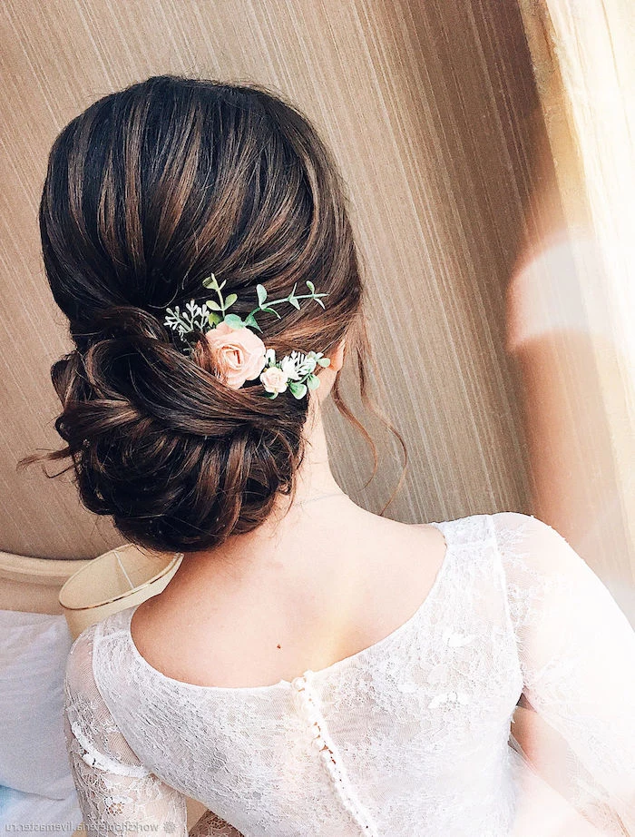 wedding hairdos, brown hair in a low updo, small flower hair accessory, white dress