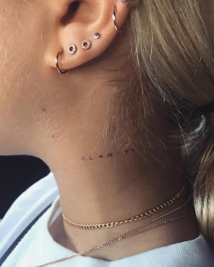 woman with a pierced ear, with blonde hair, clarity neck tattoo, small tattoos for guys, golden necklaces