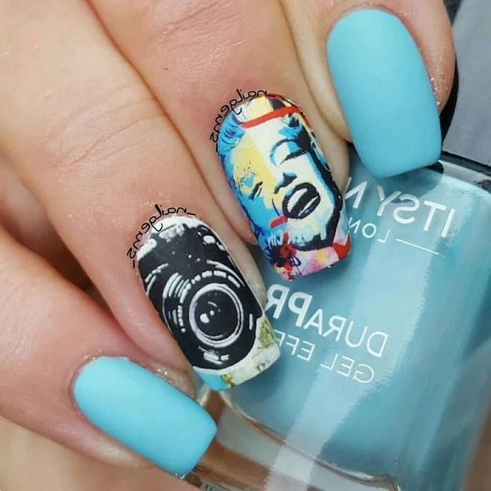 marilyn monroe inspired manicure, camera drawn on one nail, blue matte nail polish, cool nail designs