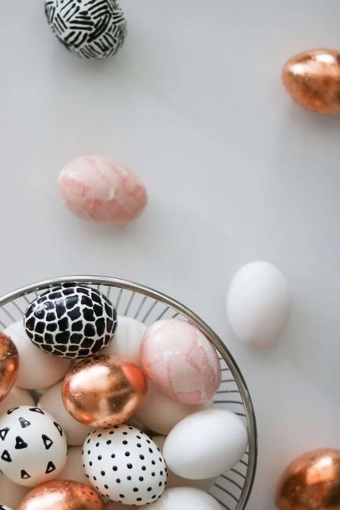 white background, easter egg coloring ideas, pink and rose gold, white and black, dyed eggs, metal bowl
