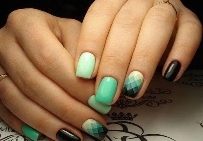 mint green and black nail polish, geometrical shapes on one of the nails, pretty nail designs, short squoval nails