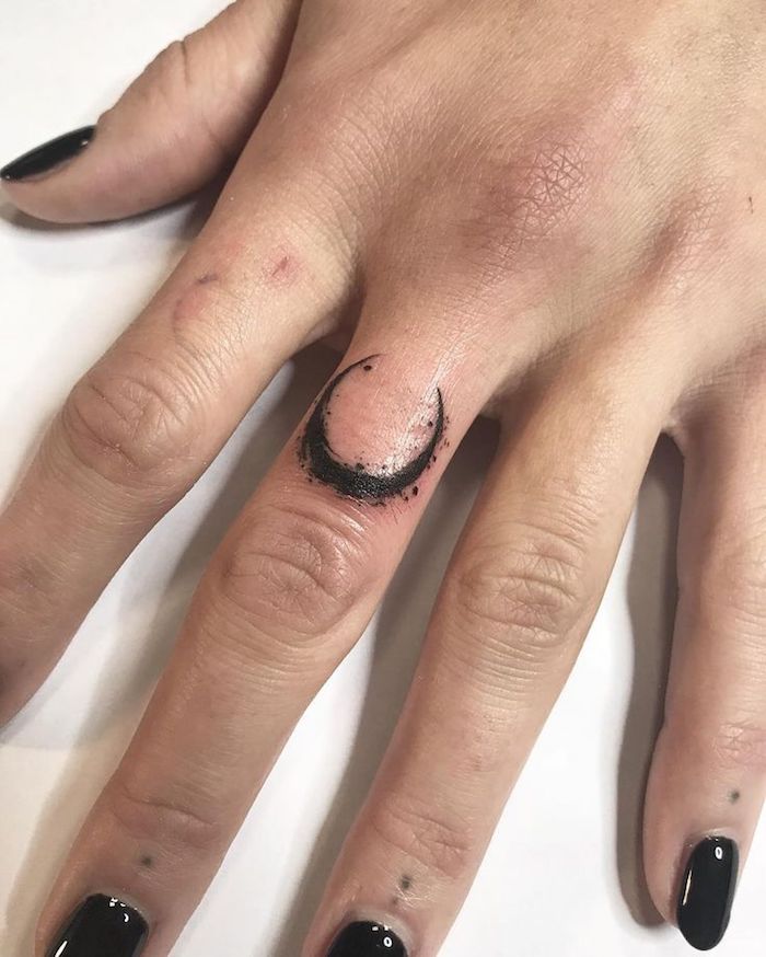 crescent moon tattoo finger