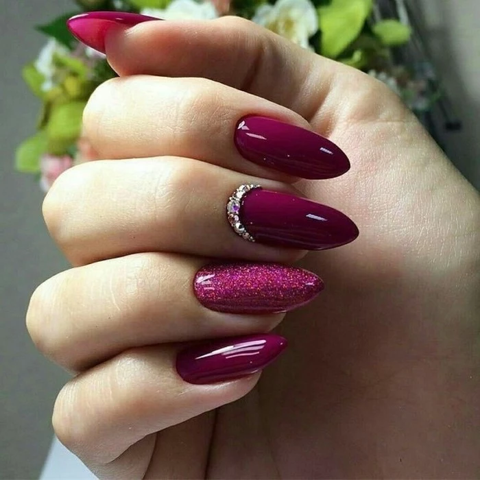 burgundy nail polish, pretty nail designs, long stiletto nails, rhinestones on one of the nails