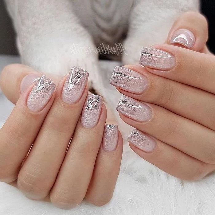 nude and silver glitter ombre nail polish, cute coffin nails, short squoval nails, both hands photographed