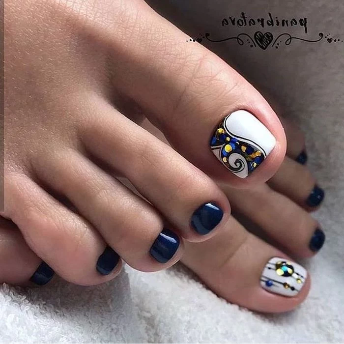 blue and white nail polish pedicure, rhinestones on the toe, nude nail designs, both feet photographed