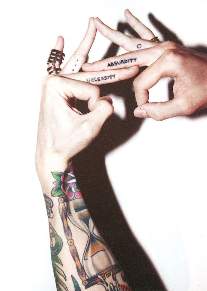 necessity and absurdity, middle finger tattoos, dots and a ring , ring finger tattoos, heart tattoo on finger