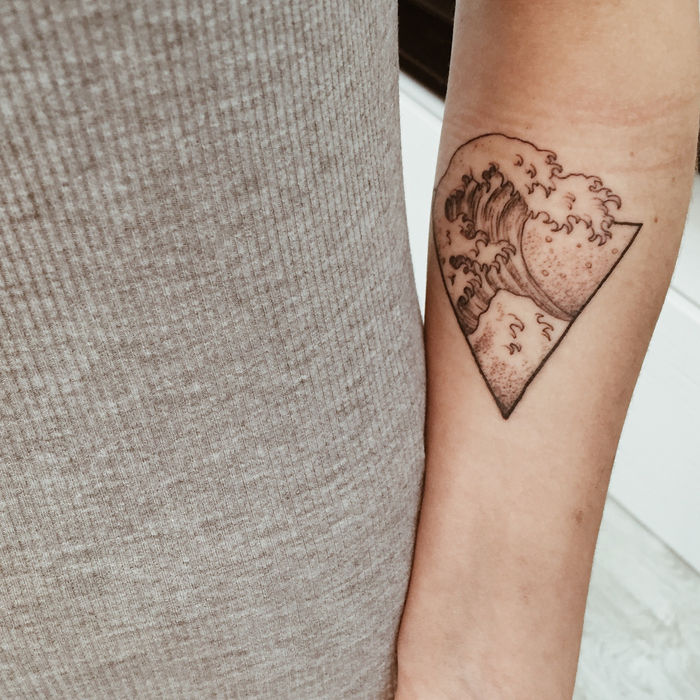 triangle wave, geometric tattoo designs, girl wearing a grey top, white background