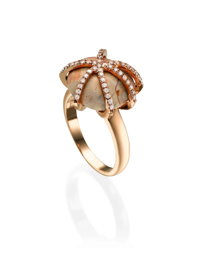opal stone, octopus shaped rose gold diamonds, beautiful wedding rings, white background