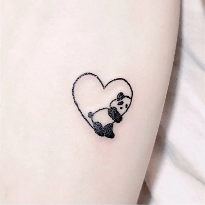 panda inside a heart small tattoo, small tattoos tumblr, in front of a white background