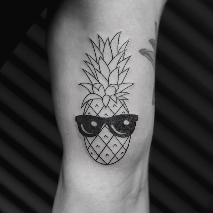 pineapple with sunglasses, tattoo on the arm, sacred geometry tattoo, black background