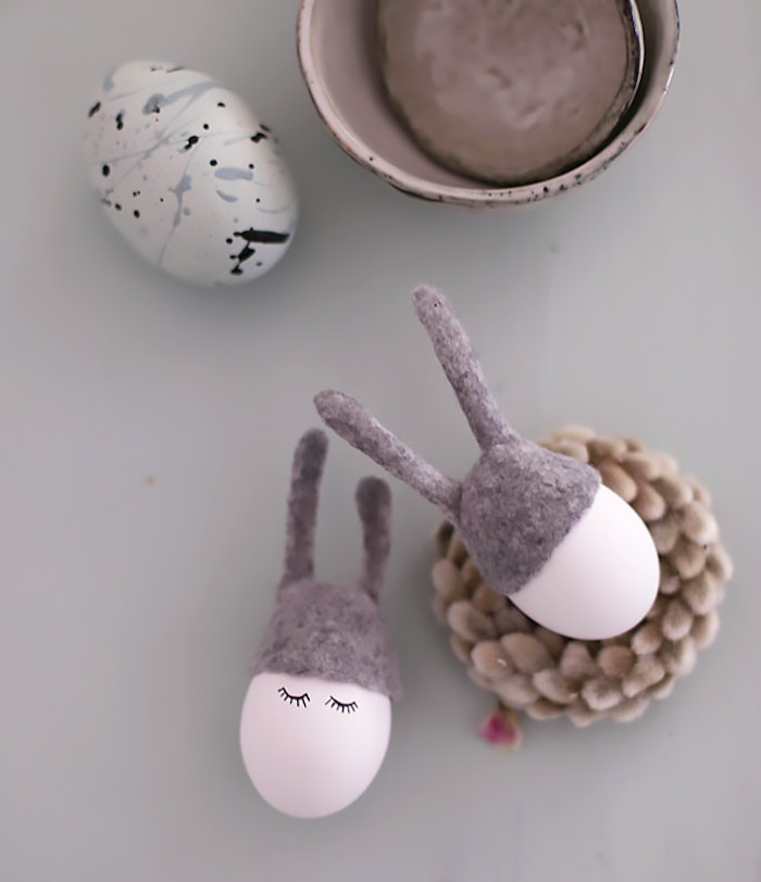 pink eggs, with eyelashes, drawn on them, natural easter egg dye, grey velvet ears, white blue and black egg