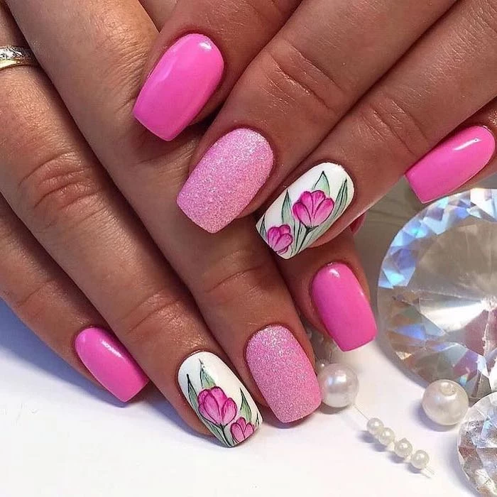 pink nail polish, nail art ideas, pink glitter nail polish, tulips drawn on two nails, pearls and diamonds around