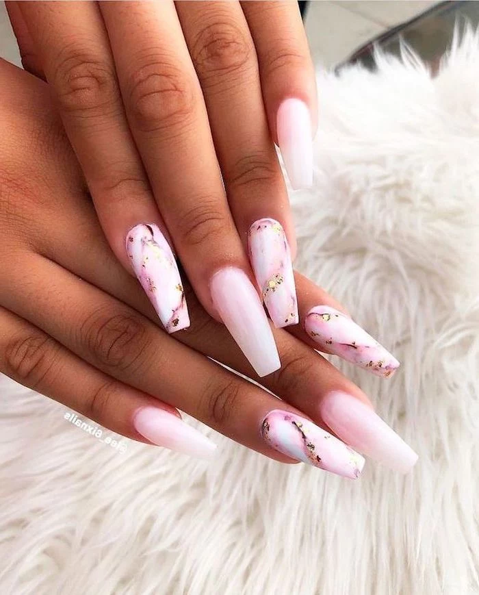 pink marble and gold nails, pink nail polish, very long coffin nails, nail art ideas, both hands photographed