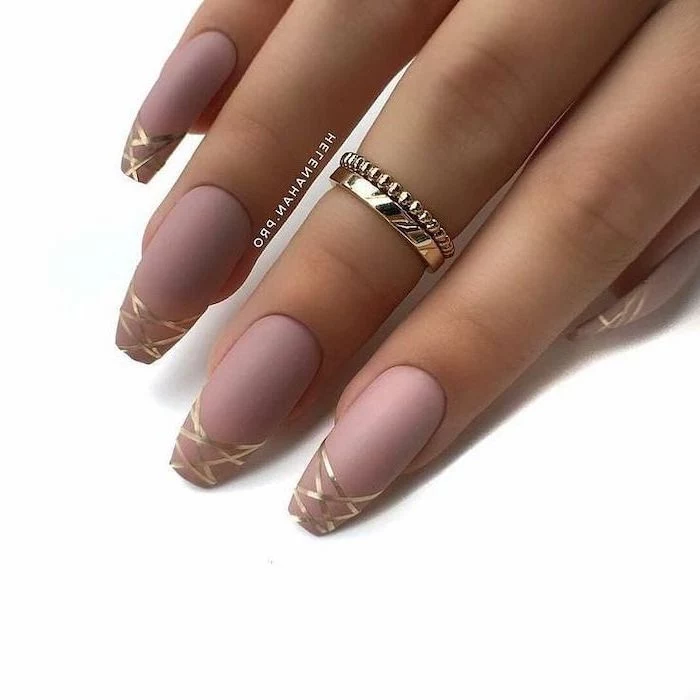 pink matte nail polish, golden lines drawn on the nails, cute nail designs, long coffin nails