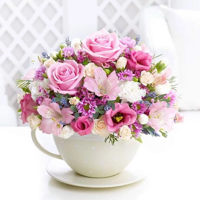 colourful flowers, in a small white cup, flower arrangements, small flower bouquet, with different flowers