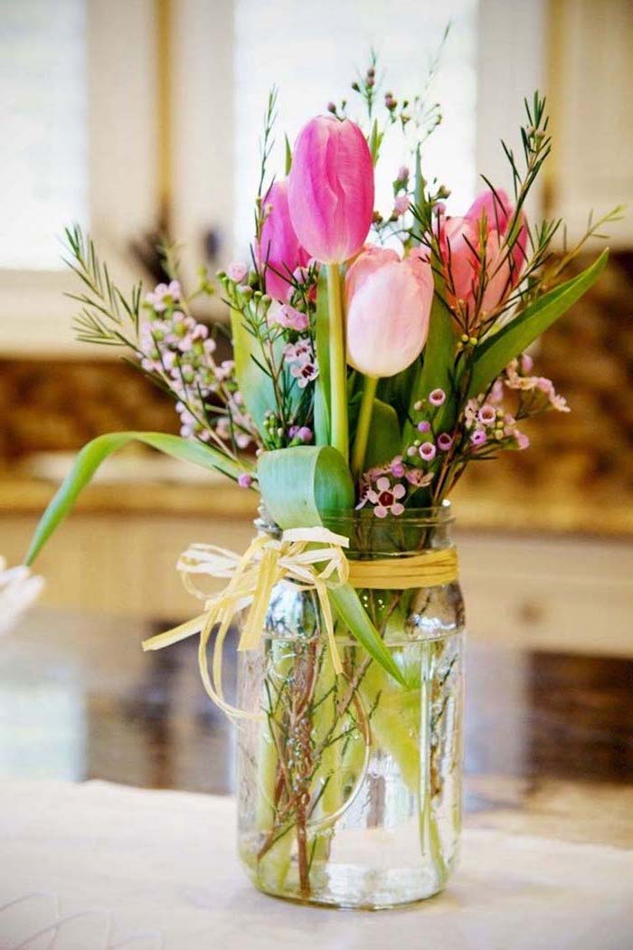 light and dark pink tulips, flower bouquet, how to make flower arrangements, in a mason jar, on a white countertop, 