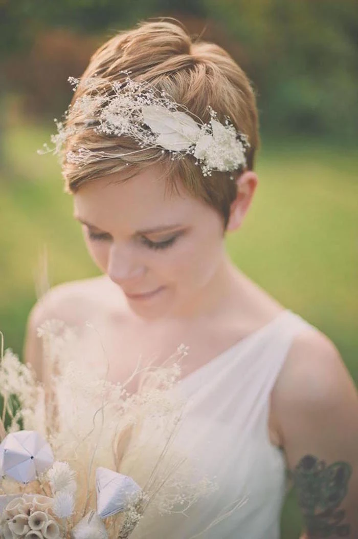 pixie cut, red short hair, floral headband, wedding hairstyles down, white dress, small bouquet 