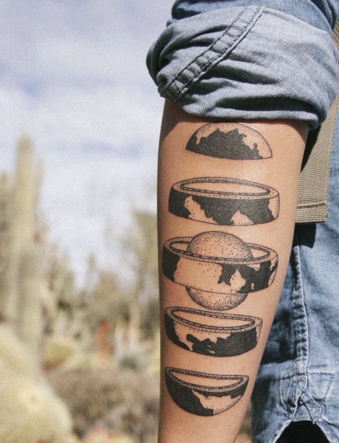 planet earth, reimagined as a russian doll, back of the arm tattoo, geometric tattoo designs