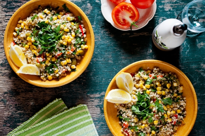 bulgur salad, with corn, 7 day healthy eating plan, lemon slices on the side, in wooden bowls